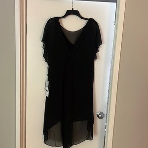 Beautiful black dress with sheer overlay. Never been worn!